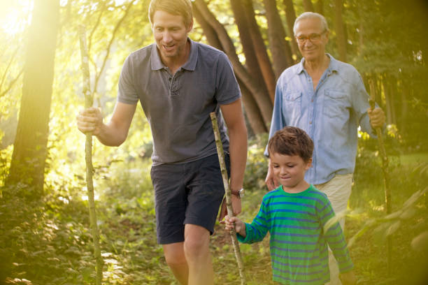 Father and son enjoying walk together in the nature surrounding.
