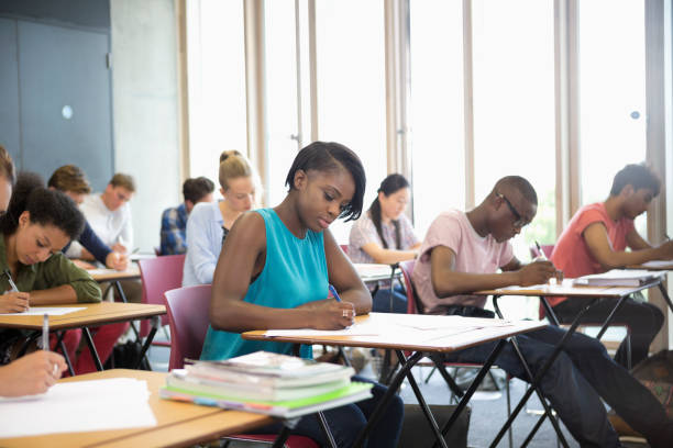 University students taking exam at classroom