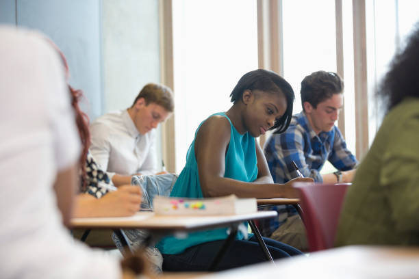 istock View of students sitting at desks during test in classroom 530683335