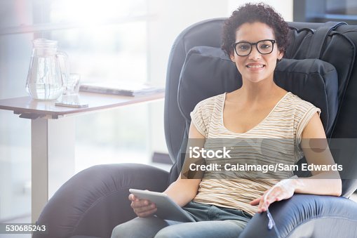 istock Smiling patient holding tablet pc, undergoing medical treatment in outpatient clinic 530685243