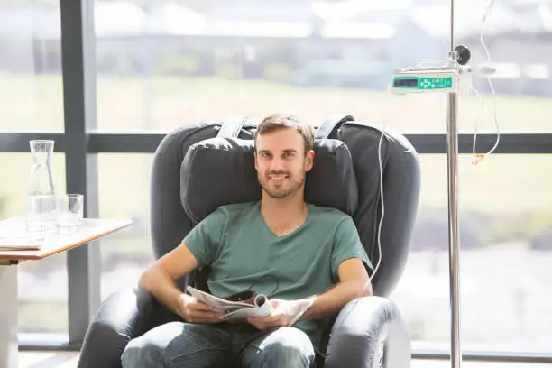 Photo of Portrait of smiling patient undergoing medical treatment in outpatient clinic