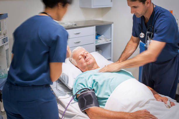 istock Doctor performing CPR on unconscious patient in emergency room 530685711