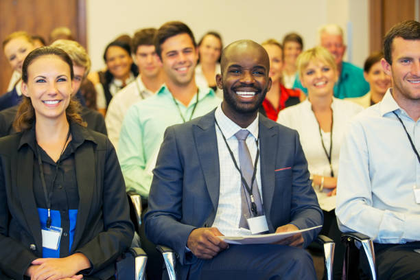 istock Smiling businessman sitting in conference room, looking at camera 530685965