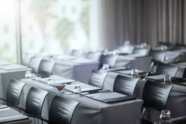 istock View of empty conference room with tables 530685985