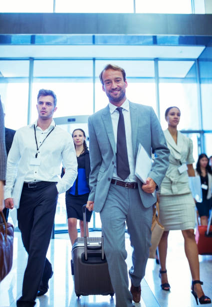 istock Businessman with suitcase and documents walking in office 530686001