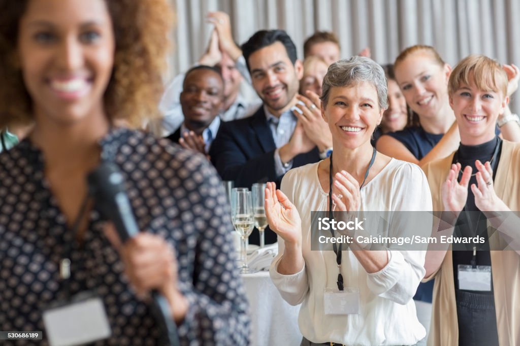 Group of people applauding after speech during conference  Meeting Stock Photo