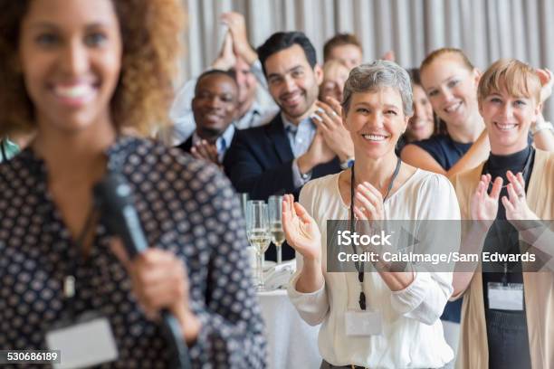 Group Of People Applauding After Speech During Conference Stock Photo - Download Image Now