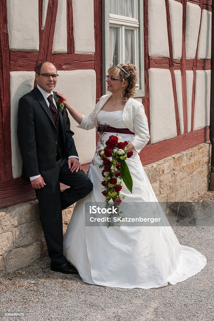 bride and groom Bridal couple in front of a half-timbered building Adult Stock Photo