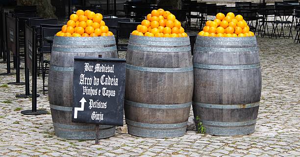 istock orange barrel obidos portugal 530691619