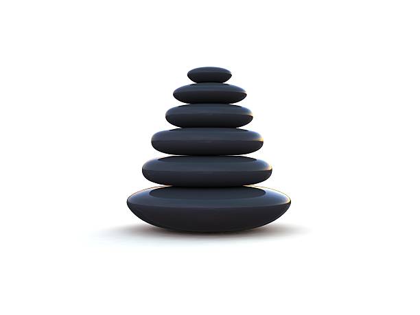 Pebbles stacked on each other on a white background