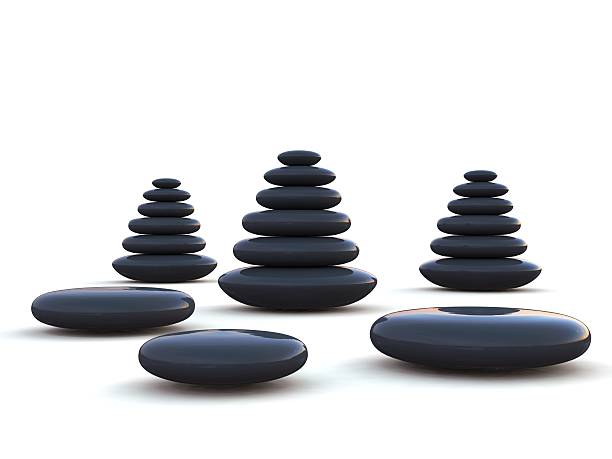Pebbles stacked on each other on a white background