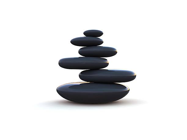Pebbles stacked on each other on a white background