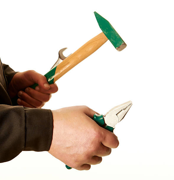 istock Tools for repair, pliers, hammer, wrench, worker hands, white background. 530693623