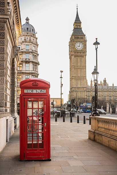 istock London - Big Ben tower and a red telephone booth 530694985