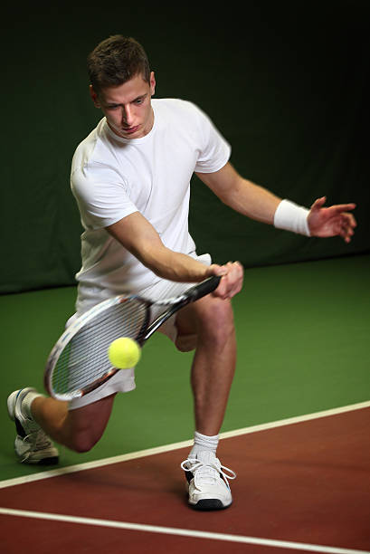 istock Young man playing tennis 530695965