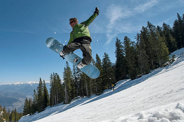 Skier with sun and mountains stock photo