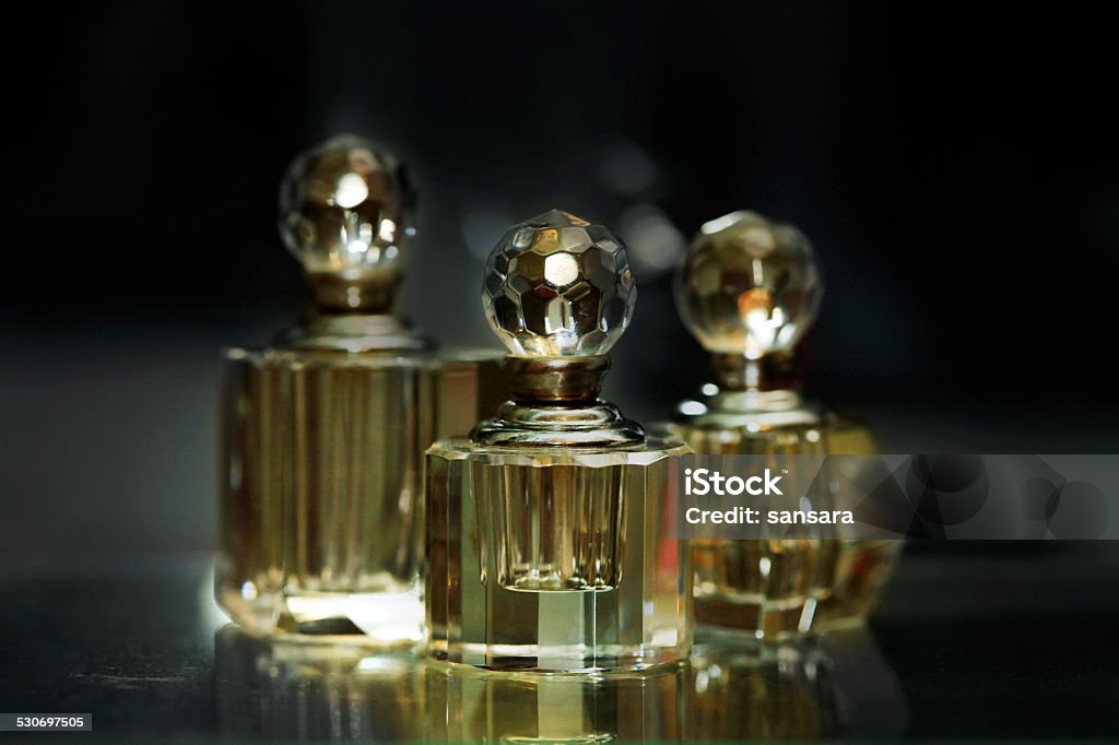 Bottles for perfumery Bottles for perfumery with patches of light Perfume Stock Photo