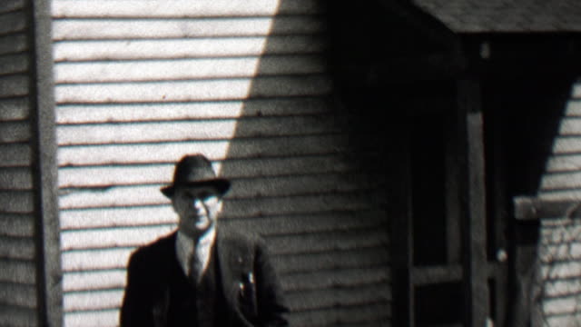 1938: Mysterious federal agent man walking from shady shadows.