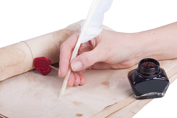 istock Female hand writing antique quill 530703635