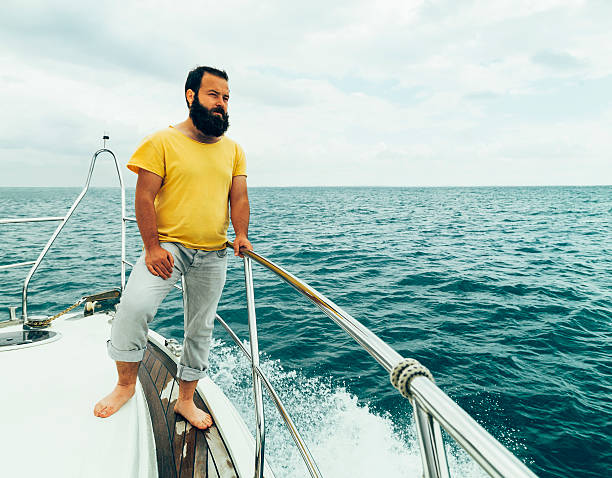 istock Man standing on sailing boat 530705761