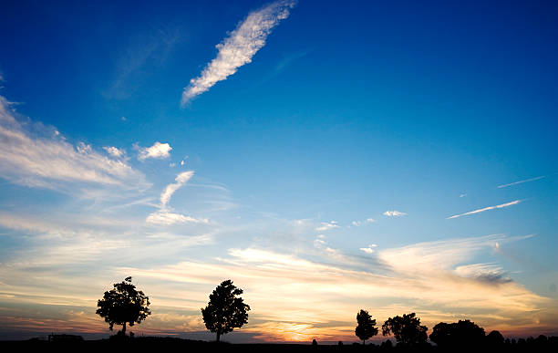 istock Sunset with clouds over rolling farmland 530706971