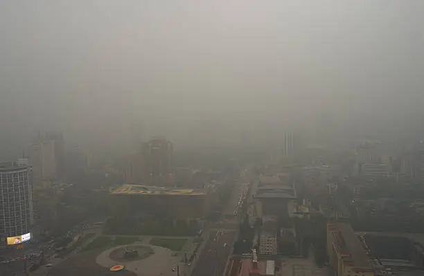Bird view at chengdu China. Fog, overcast sky and pollution.