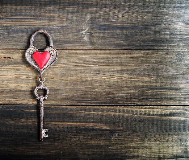 istock Heart and key on wooden background 530708793
