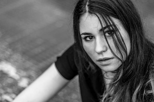 istock black and white girl right look camera bokeh dark 530710443