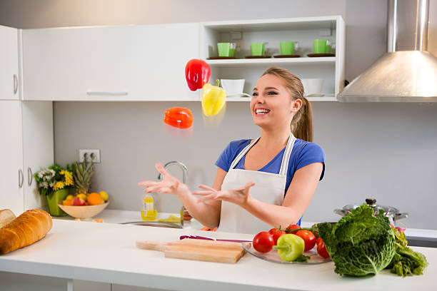 istock Young woman  juggle with vegetables 530710741