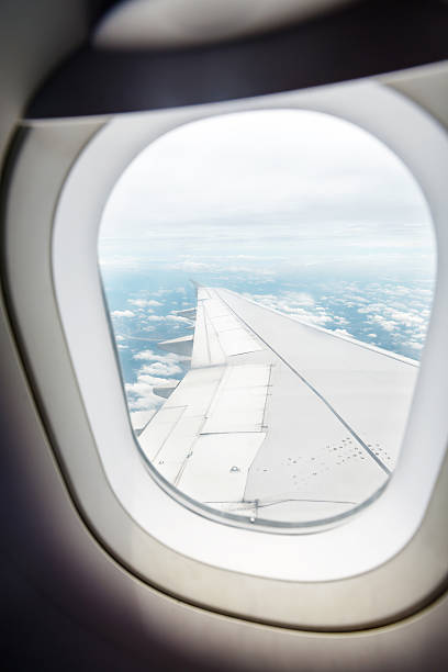 istock Clouds and sky as seen through window of an aircraft 530713909