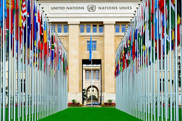 European headquarters of the United Nations Geneva, Switzerland - July 11, 2014: Geneva is the seat of the European headquarters of the United Nations.Multinational flag is particularly solemn and spectacular.Many tourists come to visit here every day. upper midtown manhattan stock pictures, royalty-free photos & images