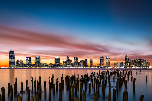 Jersey City skyline at sunset as viewed from Tribeca, New York across the Hudson River