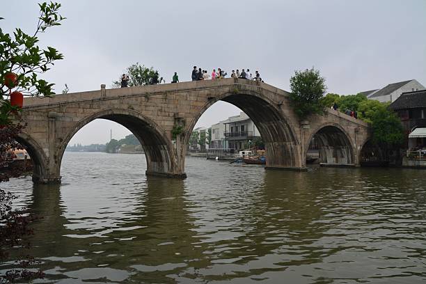 Fangsheng Bridge, Zhujiajiao Fangsheng Bridge (Setting-fish-free Bridge), the longest, largest and tallest stone bridge in Zhujiajiao and in the Shanghai region. This bridge was built in 1571. Tourists sightseeing the historical site. Zhujiajiao stock pictures, royalty-free photos & images