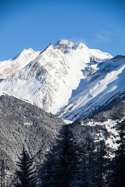 istock Huge snowy mountain range during sunny weather 530716645