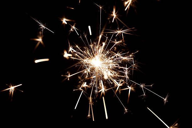 istock Celebrate party sparkler little fireworks on black background 530718305