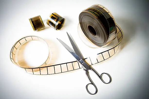 Photo of 35mm movie reel and scissors for the final cut