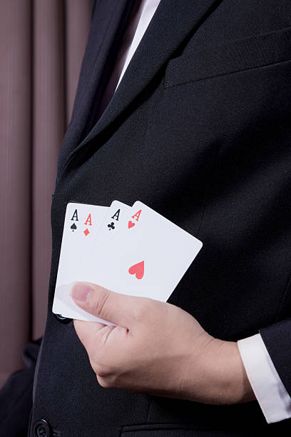 istock business man holding playing card 530727931