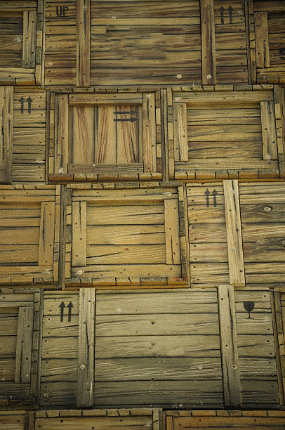 Wooden fish crates in interior of abandoned fish factory building. Old abandoned fish factory interior. Vintage wooden boxes for fish.