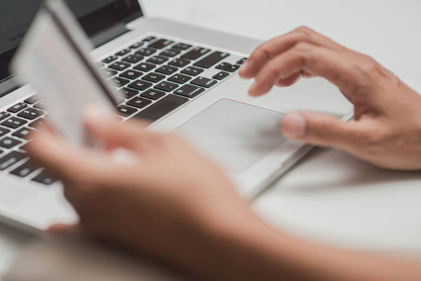 istock Close up of hands shopping online 530732117