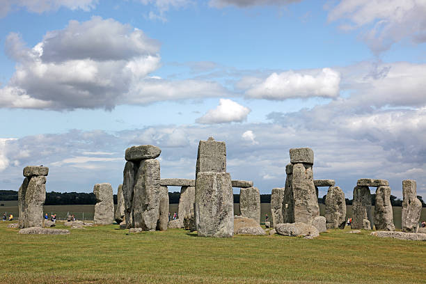 istock Stonehenge historic site on green grass 530739405