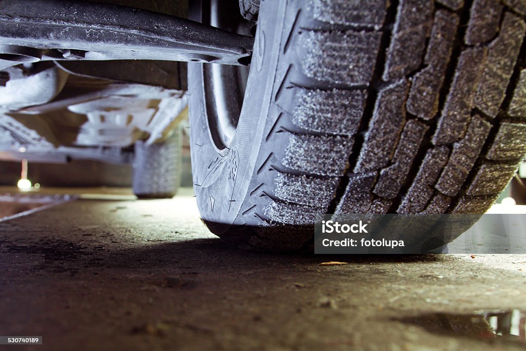 Car tyres service Closeup of a car tyres in the car repair shop background. Auto Repair Shop Stock Photo