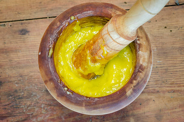 Alioli in a wood mortar on wood.