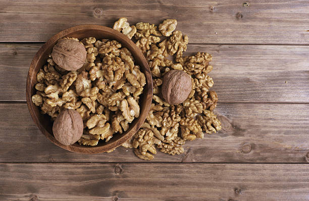 istock Walnuts in wooden bowl 530740927