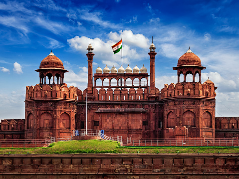 India famous travel tourist landmark and symbol - Red Fort (Lal Qila) Delhi with Indian flag - World Heritage Site. Delhi, India