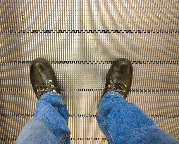 istock Foot on the escalator. 530741883
