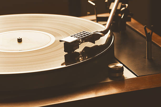 istock Elegant And Vintage Turntable Plays A Record - Vinyl 530742292