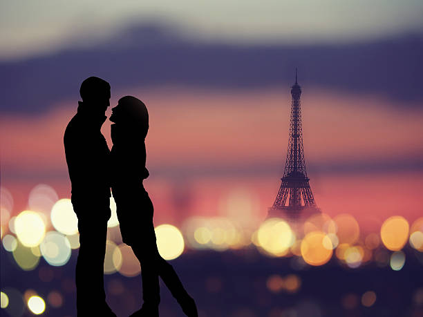 silhouette of romantic lovers with eiffel tower in Paris silhouette of romantic lovers with eiffel tower on a background in Paris , Franceabstract background : silhouette of romantic lovers with eiffel tower in Paris with sunset paris france eiffel tower love kissing stock pictures, royalty-free photos & images