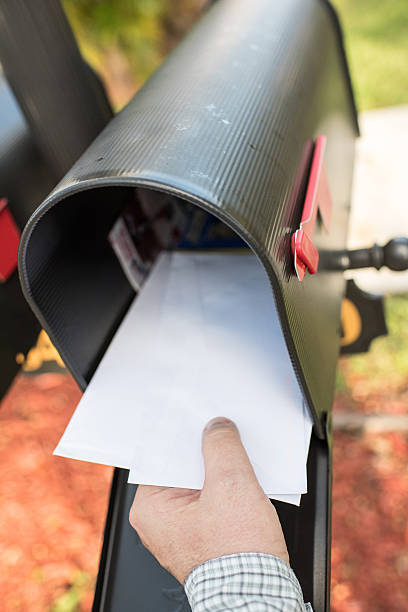 istock Male human hand getting the mail 530742571