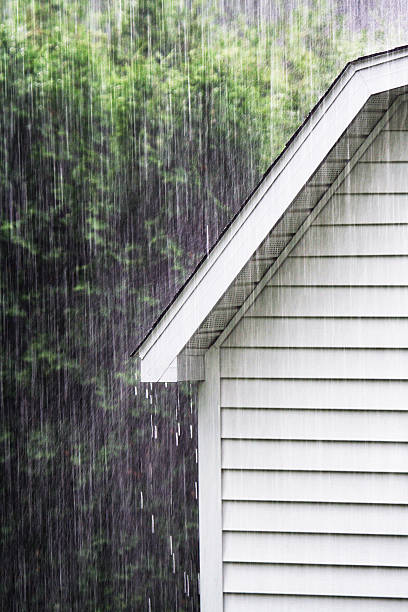 istock Drenching Rain Downpour On Old Backyard Shed 530743099