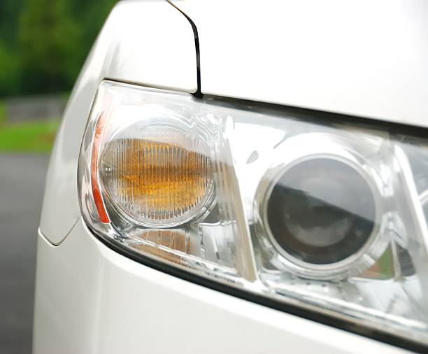 istock Automobile Headlight on a White Vehicle 530743669